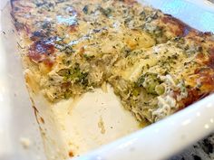 a casserole dish with broccoli and cheese