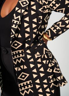 Style#: 5024/P5024 The Uyai in the Tan Black Tribal print was designed with the ladies on a mission in mind. You'll exude confidence as you strut into any room wearing this double-breasted blazer. Uyai is a sophisticated blazer that looks great with our Talia slim-leg pants to create the ultimate power suit. Features: Notch collar 2 non-functional buttons, 2 functional buttons at the waist Lined with satin 2 flap pockets at the sides 72%Rayon/ 24%Nylon/ 4%Spandex Designed in the USA, imported Ca Exude Confidence, Power Suit, Slim Leg Pants, Notch Collar, Breasted Blazer, African Inspired, Double Breasted Blazer, Slim Leg, Swimwear Accessories