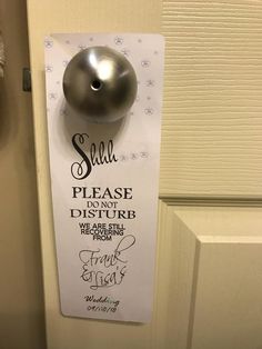 a door hanger with a silver ball on it