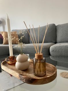 a living room with a couch, table and candles