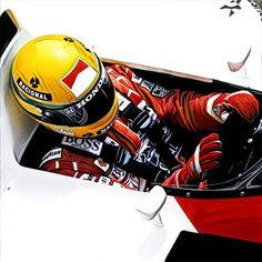 a man sitting in a race car with his helmet on