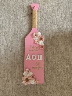 a pink bookmark with flowers on it and the words aoi life matters written in cursive writing