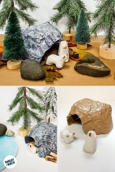 there are some fake trees and rocks on the ground with one small white bear in it