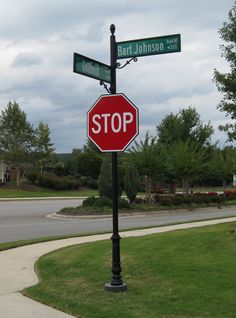 a stop sign at the corner of two streets