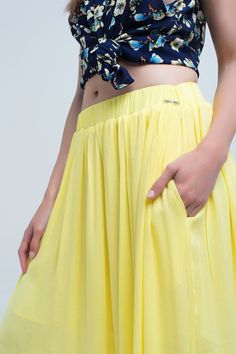 Long yellow skirt with elastic waist and side pockets. Very light and soft fabric. Skirt with ruffles. 100% Viscose Lining: 100% Polyester Long Yellow Skirt, Yellow Maxi Skirt, Clothes For Women In 30's, Yellow Maxi Skirts, Maxi Skirt With Pockets, Skirt With Ruffles, Fearless Women, Fabric Skirt, Yellow Maxi