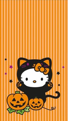 a hello kitty halloween card with pumpkins