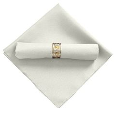 a napkin with a gold ring on it