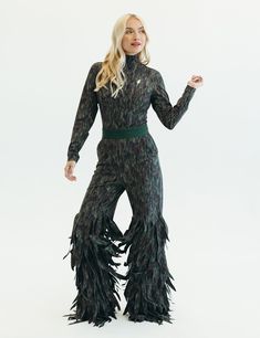 Inspired from intricate feathered jackets, Going Somewhere offers the same effect, but with the ability to wear all day long. This one-piece jumpsuit features front pockets, fringe that mimics feathers, and a silky fabric that resembles real feathers. Jumpsuit With Feathers, Jumpsuit And Blazer, Silky Fabric, Feathers, Cowboy, Jumpsuit, One Piece, Fabric, How To Wear