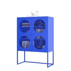 a blue cabinet with three shelves and a white bowl on top