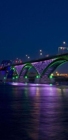 a bridge that is lit up at night