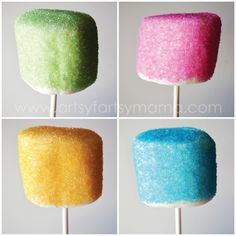 four different colored marshmallows on a stick