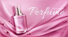 a bottle of perfume sitting on top of a pink satin covered bed sheet with the words perfume