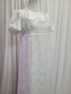 We offer a Regency styled gown, with the empire waist and short puffed sleeves.  This stunning dress has a white lace overlay and is fully lined.  The neckline has been trimmed with lace trim.       *This gown ties at the back with ribbons which can adjust the fit.      * All seams have been finished and this gown is spot clean or dry clean only.   If you have any questions about this dress, or any of our listings, please convo us before purchasing.  This listing is for the dress only, and jewel