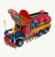 a brightly colored toy truck with lots of decorations