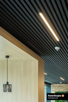 the interior of a modern office building with wood paneling on the walls and ceiling