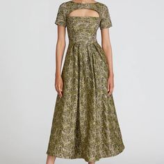 Metallic Jacquard Tea-Length Gown With Short Sleeves, Pockets, And Rounded Front Keyhole Neckline. Back Zipper Short Sleeves Pockets Front And Back Keyhole Tuck-Pleats At Waistline Tea Length Metallic Stretch Jacquard Lined Dry Clean 8816075 Https://Theiacouture.Com/Products/Theia-Natasha-Tea-Length-Gown-Gold Formal Gold Jacquard Dress, Gold Jacquard Dresses For Wedding, Gold Jacquard Wedding Dress, Gold Jacquard Party Dress, Floor-length Jacquard Party Dress, Jacquard Floor-length Party Dress, Gold Fitted Jacquard Dress, Fitted Gold Jacquard Dress, Elegant Green Jacquard Dresses