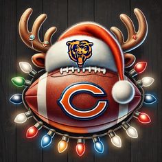 a chicago bears christmas ornament with a football and reindeer antlers on it