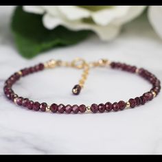 Gemstone: 4mm Mozambique Red Garnet Faceted Cut Crystal Beads. Metal: 3mm Gold Filled Round Beads Garnet Is January Birthstone Ruby Beaded Bracelets With Round Beads As Gift, Elegant Burgundy Bracelets As Gifts, Ruby Beaded Bracelets As A Gift, Ruby Beaded Bracelets With Round Beads For Gift, Elegant Ruby Beaded Bracelets With Gemstones, Elegant Ruby Gemstone Beaded Bracelets, Elegant Ruby Gemstone Beads Bracelets, Elegant Red Faceted Beaded Bracelets, Garnet Jewelry With Faceted Beads As A Gift