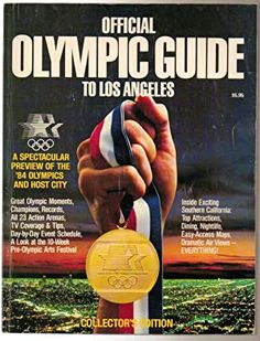 the official olympic guide to los angeles, with an image of a hand holding a gold medal