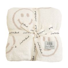 a white towel wrapped in a smiley face design