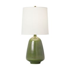 a green table lamp with a white shade