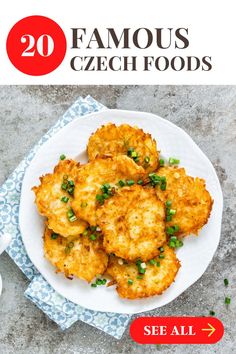 a white plate topped with fried food on top of a blue and white cloth next to a