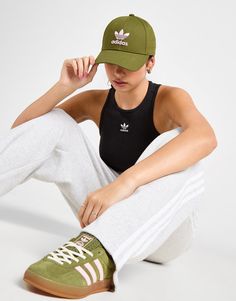 Complete your look with this Trefoil Cap from adidas Originals. In a Focus Olive colourway, this cap is cut from smooth cotton fabric for total comfort. It features a curved brim for coverage, with an adjustable strap for a custom fit and breathable eyelets for ventilation. Finished up with a Clear Pink Trefoil logo to the front. Hand wash | JC7495 Green Adidas, Front Hand, Student Discounts, Jd Sports, Custom Fit, Adidas Originals, Cotton Fabric, Hand Wash, Adidas