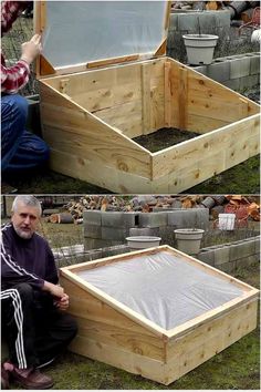 a man sitting on the ground next to a wooden box filled with dirt and water