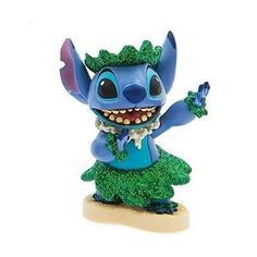 the figurine is dressed in blue and green