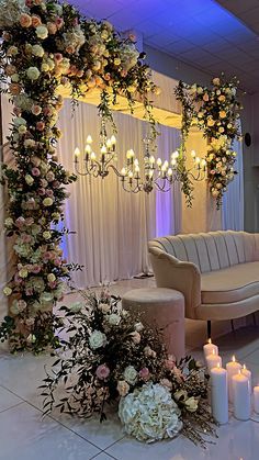 a decorated room with candles and flowers on the floor