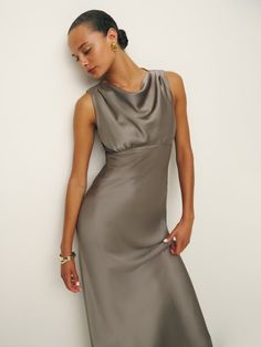 If you have to be fancy soon. Shop the Dessa Satin Dress from Reformation,  a sleeveless, maxi dress with a cowl neck. Chic Fitted Maxi Dress With Cowl Back, Chic Cowl Back Dress For Date Night, Fitted Cowl Neck Maxi Dress For Date Night, Chic Satin Maxi Dress With Cowl Neck, Formal Summer Midi Dress Cowl Neck, Formal Summer Midi Dress With Cowl Neck, Summer Formal Cowl Neck Midi Dress, Summer Formal Midi Dress With Cowl Neck, Chic Formal Maxi Dress With Cowl Neck