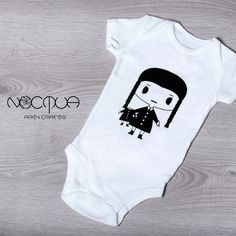 Dress your little one in spooky style with this adorable Wednesday Addams-inspired baby bodysuit! Featuring a charming design that captures the essence of the iconic character, this outfit is perfect for Halloween and every day in between.  Cute short sleeve white baby bodysuit with original Noctua Art & Crafts design (custom text like a name can be added, just write me a message), made from soft, breathable high quality 100% cotton fabric (OEKO-TEX standard), it ensures all-day comfort for your Spooky Style, Art And Craft Design, Baby Grow, Goth Girl, Nursery Gift, Halloween Baby, Wednesday Addams, Baby Body, Cute Shorts