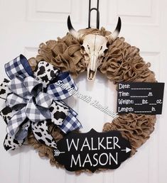 a wreath with a cow skull on it