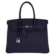 Mightychic offers a rich Hermes Birkin 30 bag featured in Bleu Indigo. This rich deeply saturated dark blue iBirkin bag s a timeless classic. Crisp with palladium hardware. Classic and timeless this beautiful Hermes bag takes you from to evening in one step. Comes with the lock and keys in the clochette, signature Hermes box with ribbon, sleepers and raincoat. NEW or NEVER WORN. final sale BAG MEASURES: LENGTH 30 cm / 12" TALL 21 cm / 8.5" DEEP 15 cm / 6" HANDLES: TALL 4" CONDITION: NEW or NEVER Blue Birkin, Hermes Birkin Handbags, Birkin Handbags, Box With Ribbon, Birkin 30, Cargo Pants Outfit, Blue Accessories, Hermes Birkin 30, Hermes Box