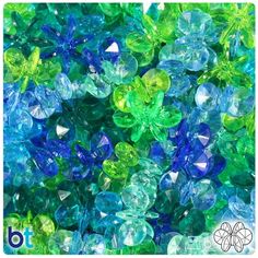 blue and green glass beads are scattered together