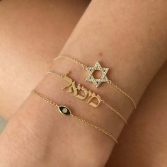 The 14K Gold Personalized Hebrew Nameplate Bracelet is a luxurious piece of jewelry to adorn your wrist. Crafted from 14k solid gold, the bracelet features a personalized plate with a Hebrew name of your choice, to add a unique touch of sophistication and modern elegance. Wear this classic and timeless piece of jewelry to show off your personal style. For personalization, enter the Hebrew name in the designated box. If you are unable to type in Hebrew, please use Google Translator to convert you Nameplate Bracelet, Ear Art, Feminine Necklace, Cuban Link Necklace, Safety Pin Earrings, Diamond Evil Eye, Medallion Necklace, Initial Jewelry, Diamond Star