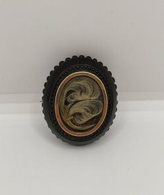 Antique Victorian hair brooch. Made in the UK in the mid 19th century, the stylised blonde hair is set in a gold-rimmed jet frame. Victorian Hair Jewelry, Jet Hair, Victorian Hair, Hair Brooch, Victorian Hairstyles, Antique Victorian, Hair Jewelry, Favorite Jewelry, Brooch Pin