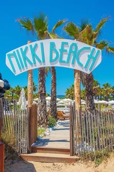 there is a sign that says tiki beach on it