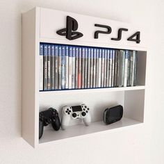 a white shelf with video games and controllers on it