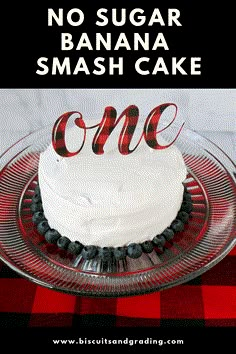 a cake on a plate with the words no sugar banana smash cake in red and black