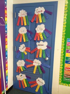 a door decorated with rainbow ribbons and clouds