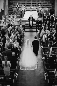 the bride and groom are walking down the aisle