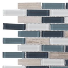 the back side of a glass and wood mosaic tile backsplash with white, gray, and black strips