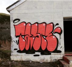 graffiti on the side of a white building