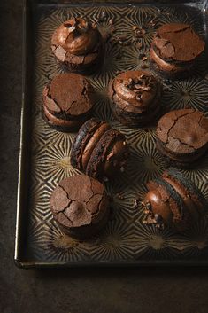 chocolate desserts and cookies on a metal tray