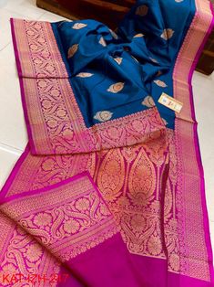 Extremely beautiful Pure katan Benarasi saree .Dual tone peacock blue body with Deep pink zariwoven border.Rich handcrafted zari work on border and pallu.Alloverbody has big zari buttas. Saree is very pretty, light weight, with elegant look,silk quality is just awesome. Surely you will fall in love with the quality and texture of the saree when you get it on your hand. Saree has contrast Blouse Blouse stitching facility available with extra cost. Best suited for weeding, party,puja,gifting. Read Blue Silk Lehenga With Zari Weaving, Elegant Blue Banarasi Silk Lehenga, Elegant Blue Lehenga With Zari Weaving, Blue Jamawar Lehenga For Wedding, Blue Raw Silk Lehenga With Zari Weaving, Unstitched Blue Katan Silk Lehenga, Elegant Blue Katan Silk Saree, Blue Tussar Silk Lehenga For Wedding, Blue Jamawar Lehenga For Traditional Ceremonies