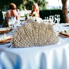 This hand-knitted bag is shaped like a delicate seashell, offering a touch of coastal charm that seamlessly complements all outfits from day to night. The interior is lined with luxurious satin fabric, providing a soft haven for your belongings. Versatile and lightweight, this bag is perfect for casual outings, beach strolls, evening soirees, and even weddings. Its handmade craftsmanship ensures a unique and elegant touch, making it an ideal gift or a stylish companion for your everyday adventures. Features: Hand-knitted with precision and care Inside lined with satin fabric Unique design for a one-of-a-kind fashion statement If you are interested in a specific color or size, please feel free to contact us. We can customize this item in several different colors and sizes to meet your prefe Seashell Fashion, Beige Handbag, Hand Knit Bag, Knit Bag, Shell Bag, Pearl Embroidery, Knitting Tote Bag, Knitting Tote, Beige Handbags