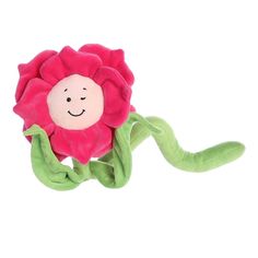 a pink flower with green stems and a smiling face on it's back end