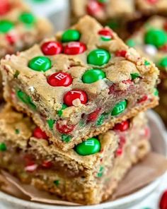 christmas cookie bars stacked on top of each other with m & m candies in the middle