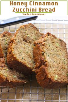 three slices of zucchini bread on a cooling rack with a knife in the background